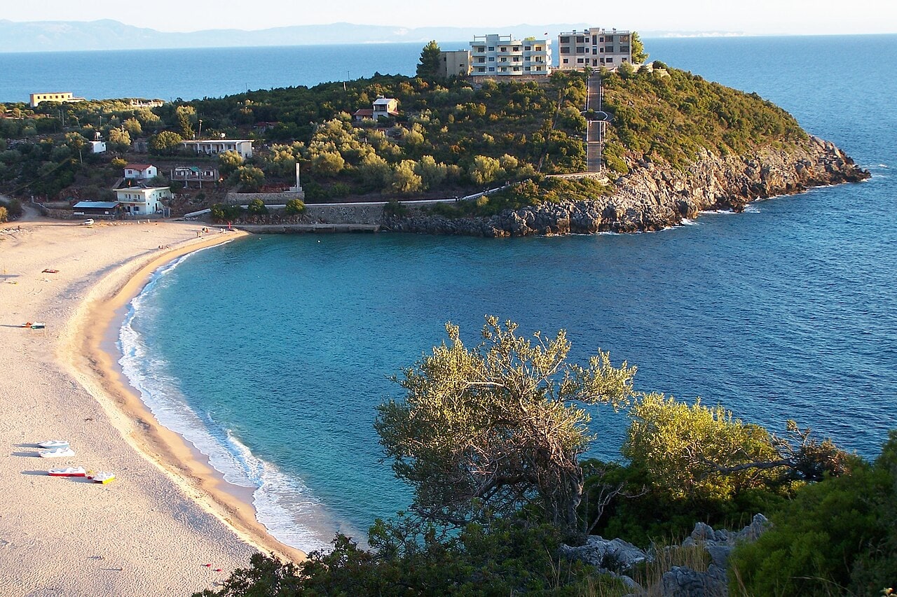 Jalë Beach near Himarë, a pebble cove on the Albanian Riviera backed by steep green hillsides