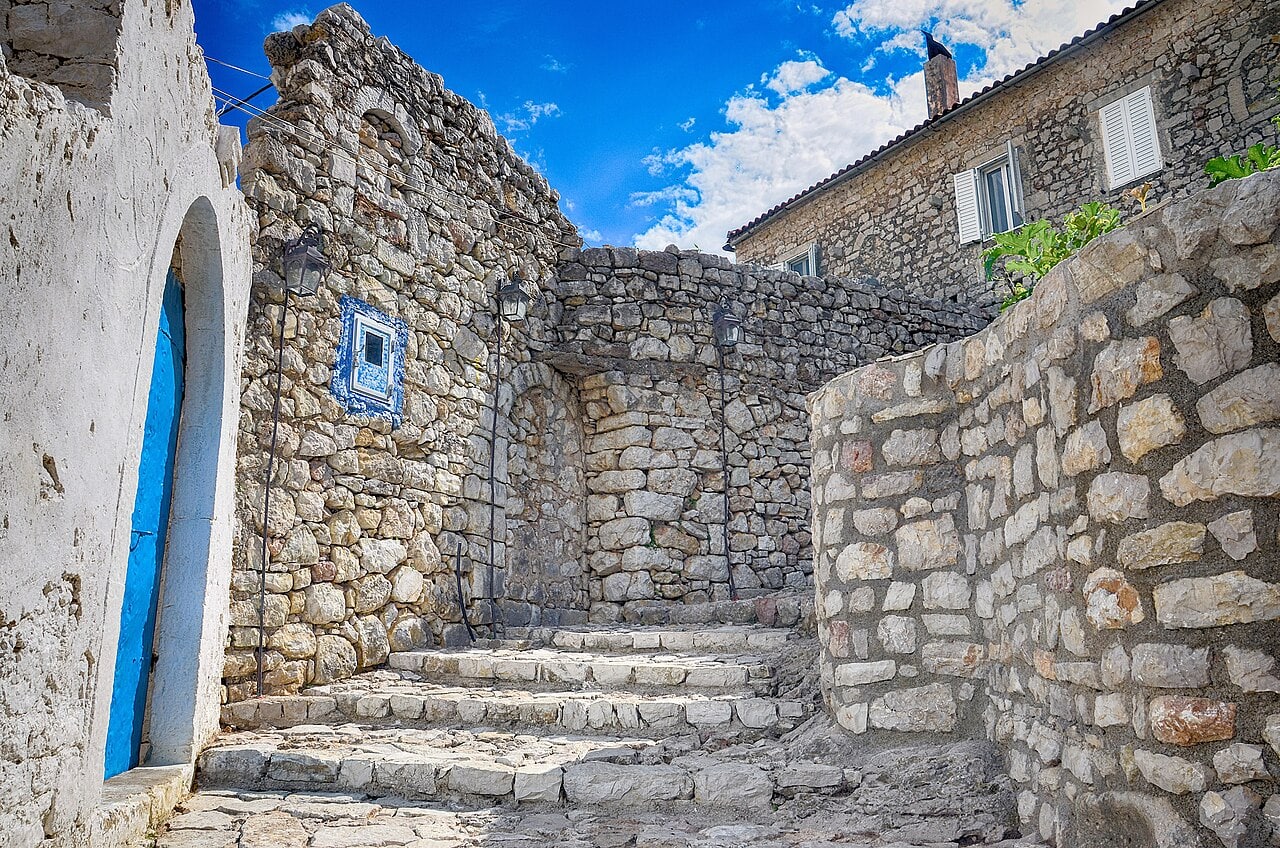 Narrow stone street in Himarë's hillside Old Town (Kastro), inside the historic castle district