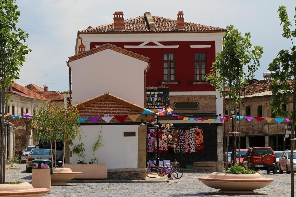 Restored Ottoman-era Old Bazaar in Korçë, Albania with stone buildings and cobblestone streets