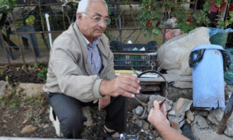 Blacksmith selling his work © Gjergj Erebara