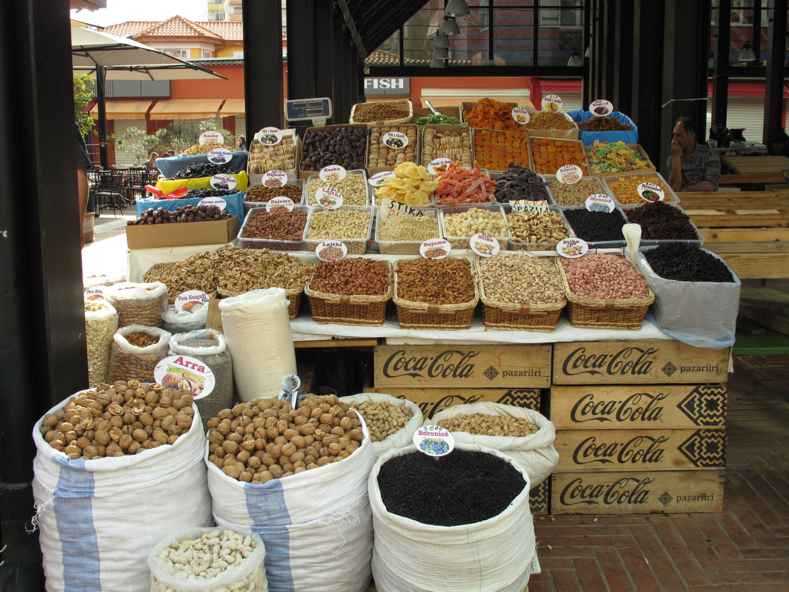 Colorful produce and dried fruit stalls at Pazari i Ri market in Tirana