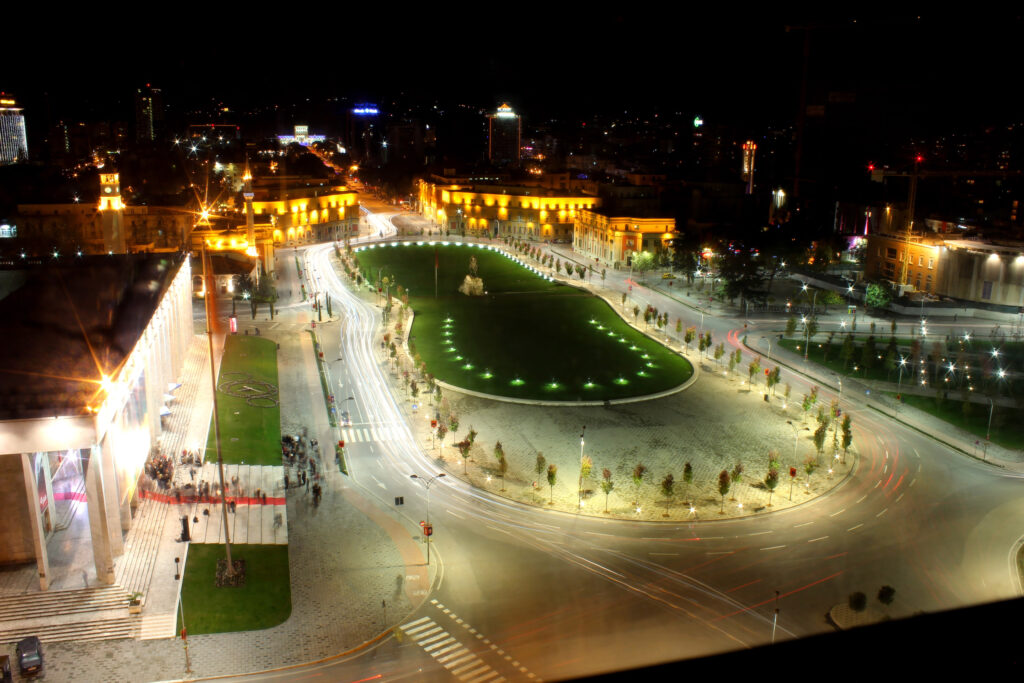 Tirana city illuminated at night, capturing the festive atmosphere of the Albanian capital