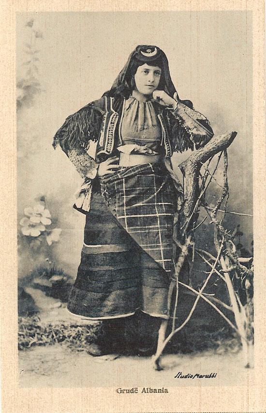 Historical Marubi photograph of an Albanian woman from Grudë wearing the traditional xhubleta bell-shaped felt skirt