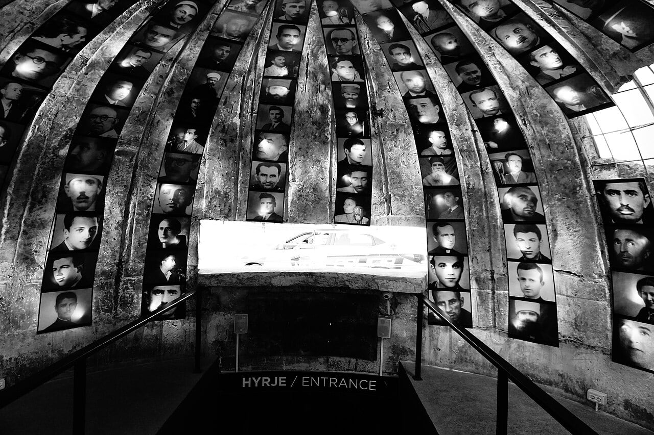 Domed concrete entrance to Bunk’Art 2 in Tirana with photographs of persecuted Albanians lining the ceiling
