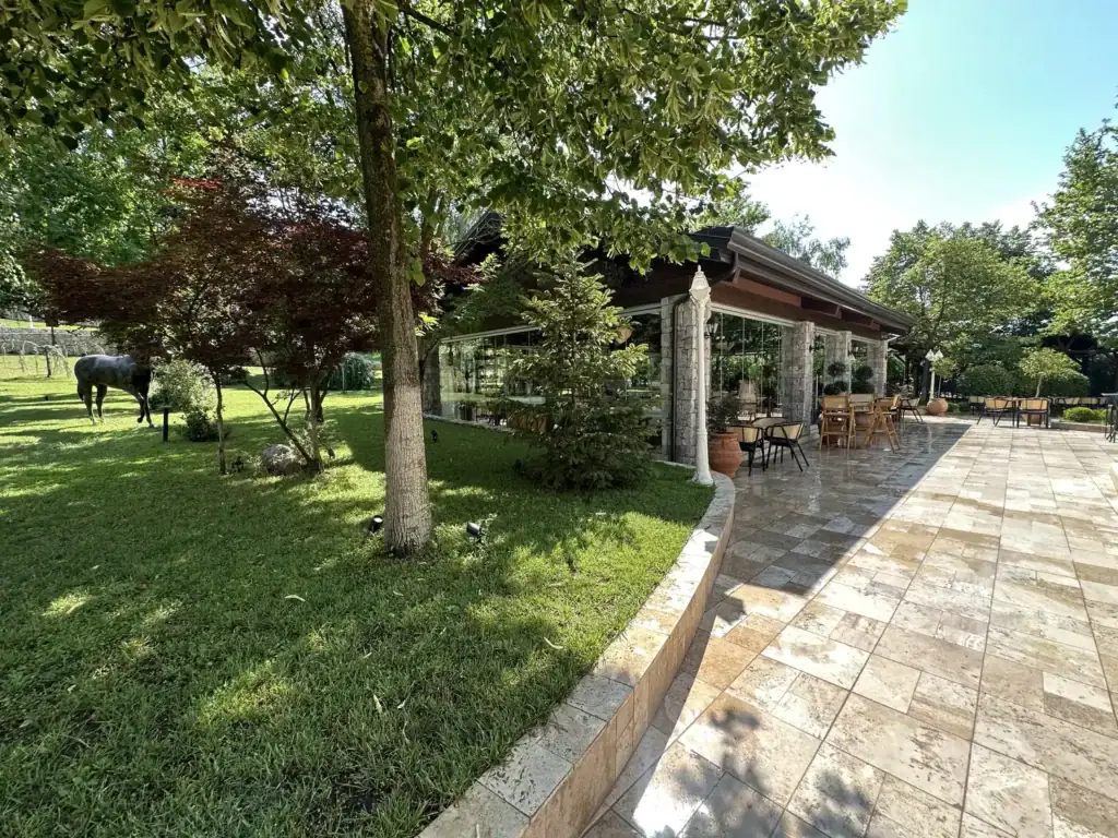 Farm 88 restaurant garden and travertine terrace with stone pavilion, in the countryside near Mullet, southeast of Tirana