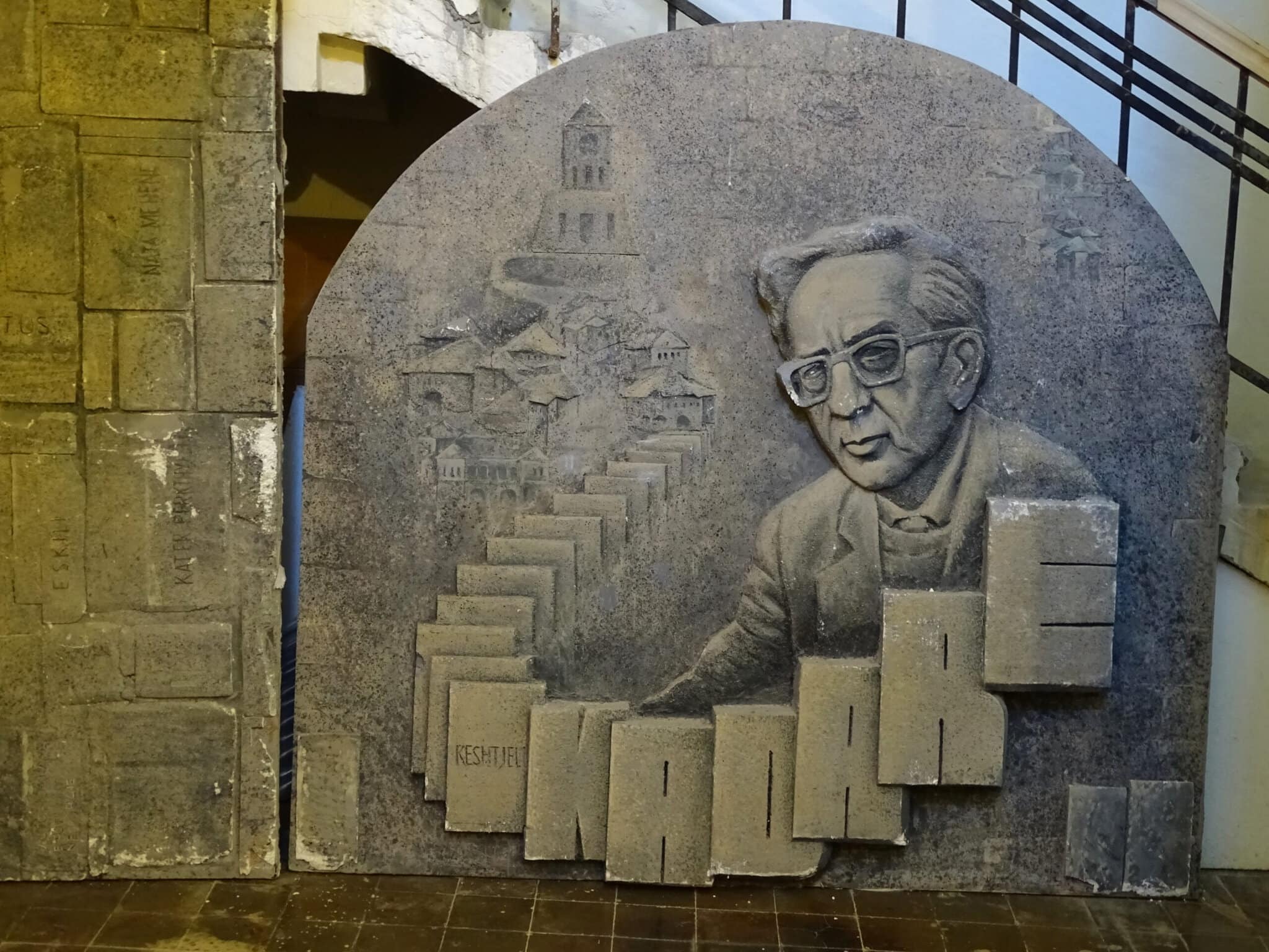A stone relief sculpture at Gjirokastra Castle honoring the writer Ismail Kadare
