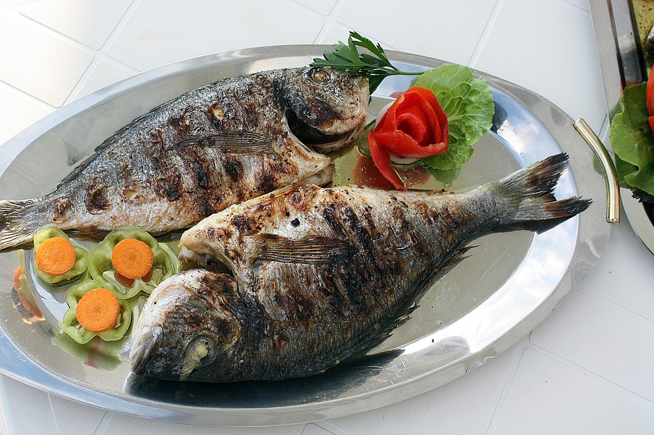 Simply plated whole grilled fish, the style most Tirana restaurants serve their daily catch
