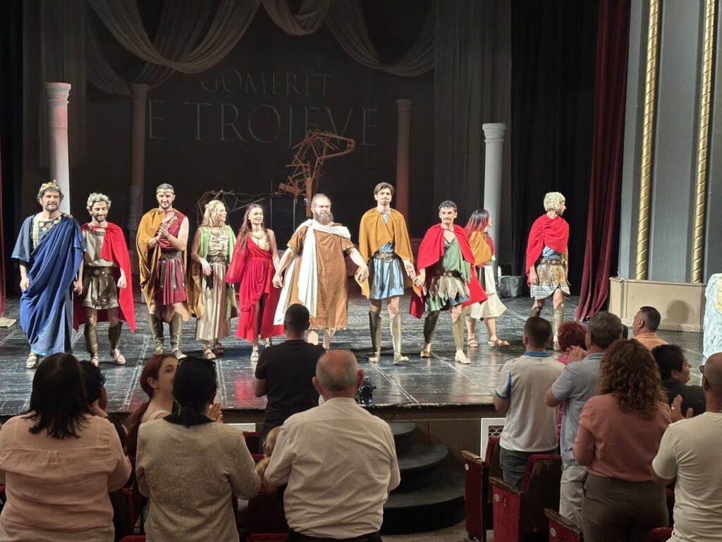 The full ensemble of Gomerët e Trojeve lined up on stage in Shkodra